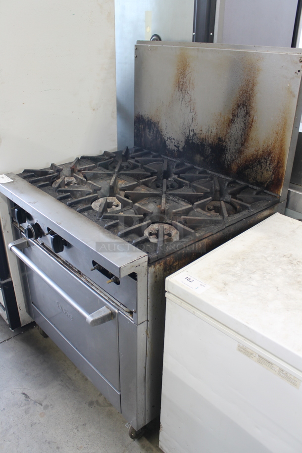 Stainless Steel Commercial Natural Gas Powered 6 Burner Range w/ Oven, Over Shelf and Back Splash on Commercial Casters. - Image 1 of 6