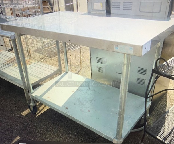 One Stainless Steel Table With Undershelf On Casters. 48X30X39