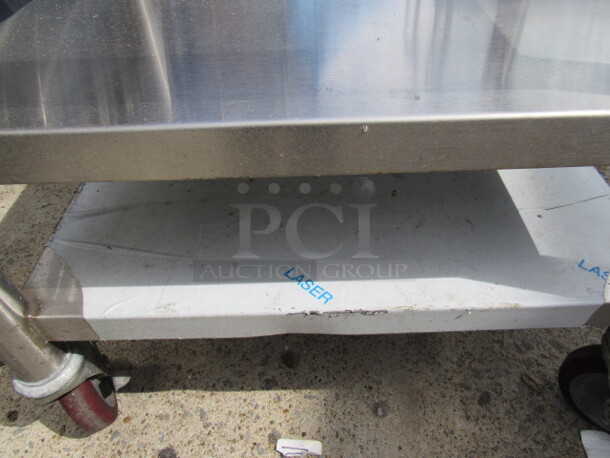 One NEW Stainless Steel Equipment Table With 19X16.5 Top Cut Out, And 2 Stainless Under Shelves On Casters. 24X21X26 - Image 2 of 3