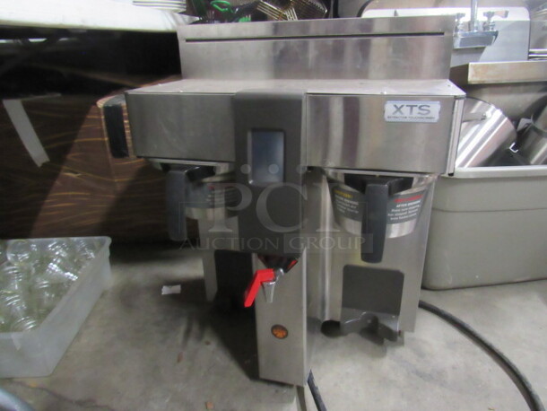 One Fetco Dual Coffee Brewer With Filter Baskets. Model# CBS-2132-XTS. 208/240 Volt. 19.5X16X26.5.