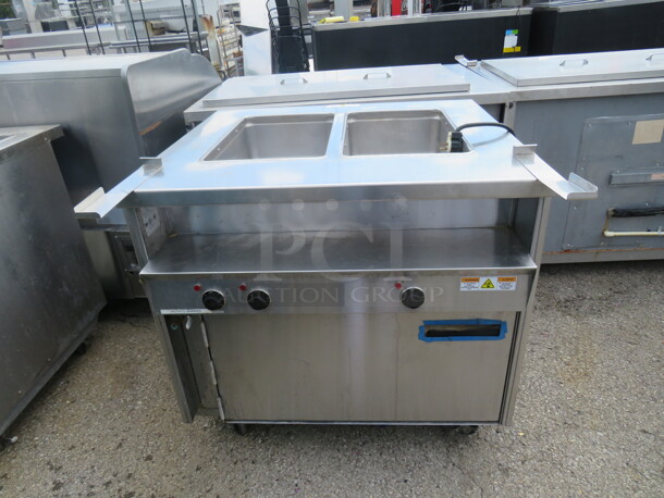 One SS Randell 2 Well Steam Table With 1 Door Warmer Under On Casters. Model# 31330. 208/240 Volt. 1 Phase. 33X33X35 - Image 1 of 2