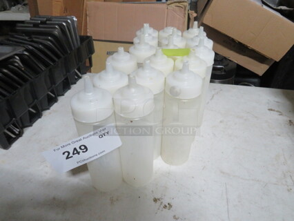 One Lot Of 17 Squeeze Bottles With Lids.