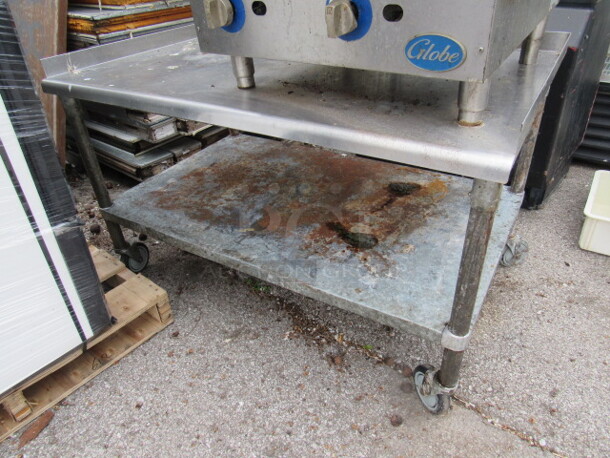 One Stainless Steel Equipment Stand With Under Shelf On Casters. 49X31X31