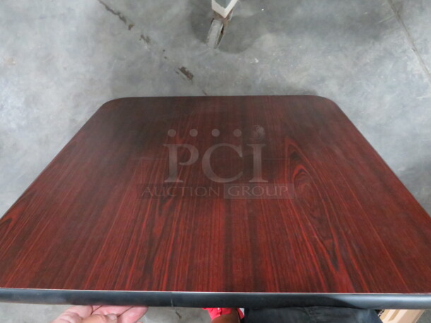 One NEW Laminate Table Top. 24X24. Black/Brown. - Image 2 of 2