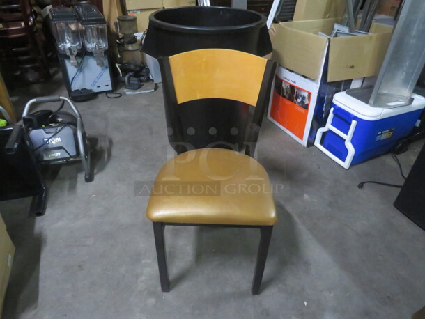 Black Metal Chair With Wooden Back And Gold Cushioned Seat. 2XBID