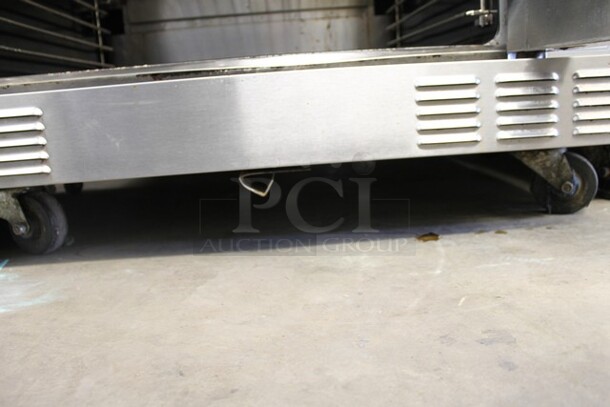 2018 US Range SUMG-100 Stainless Steel Commercial Natural Gas Powered Full Size Convection Oven w/ View Through Doors, Metal Oven Racks and Thermostatic Controls on Commercial Casters.  - Image 4 of 5