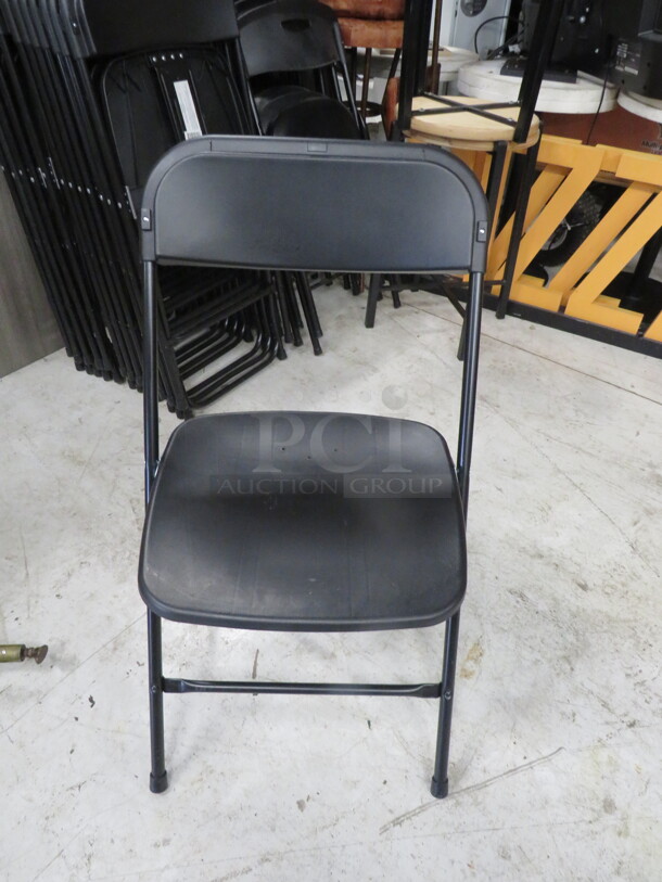 Black Poly Folding Chair. 4XBID - Image 1 of 1