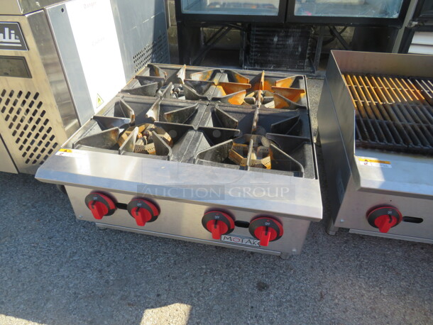 One Motak Propane  Table Top 4 Burner. Model# MHP-24.  24X28X13 - Image 1 of 1