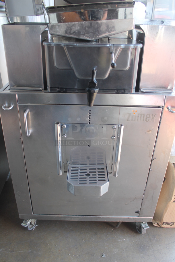 2017 Zumex Speed Pro Tank Podium Stainless Steel Commercial Floor Style Citrus Juicer on Commercial Casters. Comes w/ Extra Pieces: See Pictures For Details! 115 Volts, 1 Phase. Powers On But Parts Do Not Move - Image 7 of 11