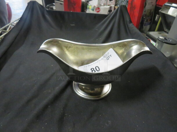 One Stainless Steel Gravy Boat.