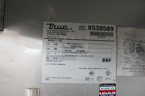 2015 True T-35 Stainless Steel Commercial 2 Door Reach In Cooler w/ Poly Coated Racks on Commercial Casters. Tested and Powers On But Does Not Get Cold
 - Image 7 of 7