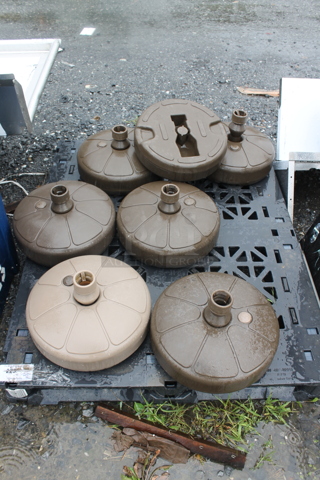 PALLET LOT of 7 Brown Metal Patio Umbrella Bases. 7 Times Your Bid!