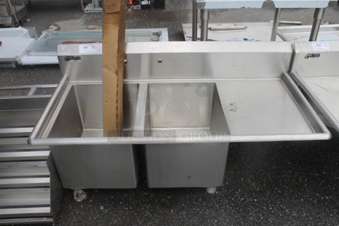 BRAND NEW SCRATCH AND DENT! Universal M-2N162014-RDI8 Stainless Steel Commercial 2 Bay Sink w/ Right Side Drain Board and Legs. Bays 16x20x14. Drain Board 16x22