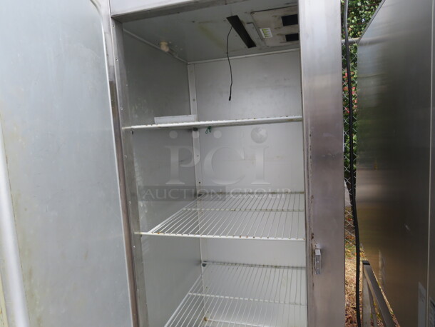 One Working Traulsen 1 Door Reach In Freezer With 3 Racks On Casters. Model# SG12011. 115 Volt. 30X35X83 - Image 2 of 2
