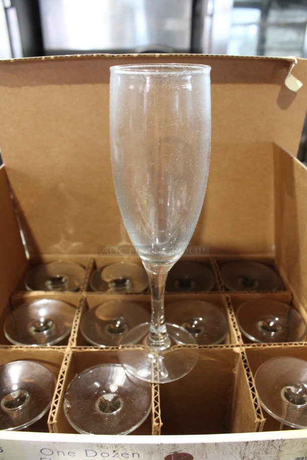 12 BRAND NEW IN BOX! Qualite Champagne Flute Glasses. 2.5x2.5x7.75. 12 Times Your Bid!
