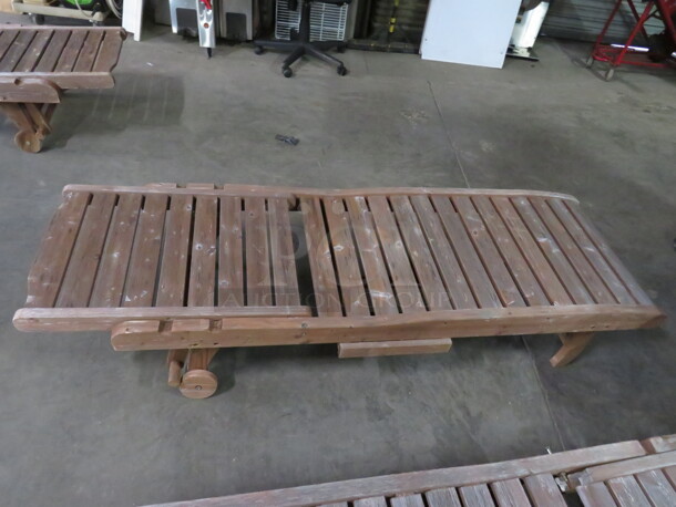 One Adjustable Wooden Chaise Lounger With 2 Wheels, And A Pullout Shelf. Needs A Lil Adjusting. 72X23 - Image 1 of 2