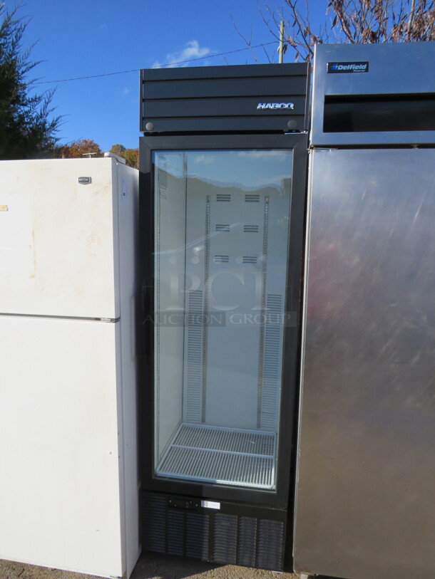 One Habco 1 Door Glass Display Refrigerator With 2 Racks. LOOKS NEW! 115 Volt. Model# SE18. 24X25X79.