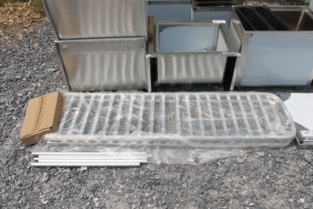 BRAND NEW SCRATCH AND DENT! Regency 109APR1826L Commercial Stainless Steel Unassembled Sheet Pan Rack.