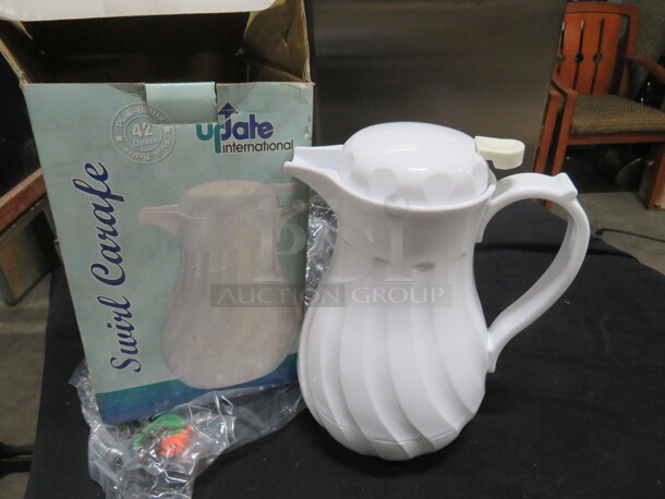 One NEW 42oz Swirl Carafe. - Image 1 of 1