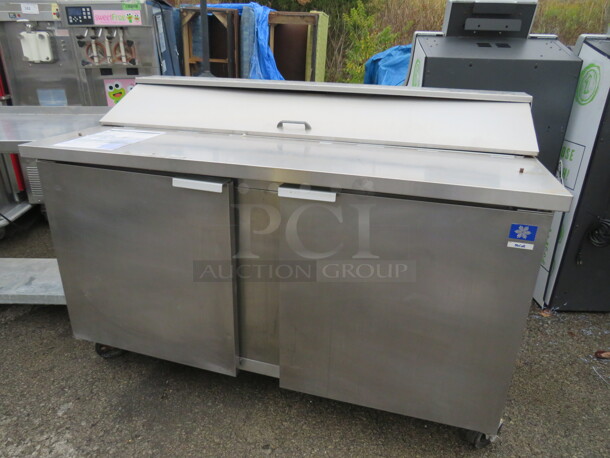 One McCall 2 Door Refrigerated Prep Table On Casters. 115 Volt. Model# D-15-16. 60X30X43. Working Not Cold.