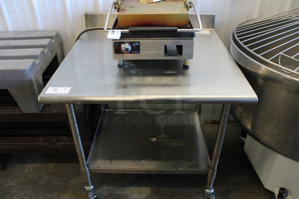 Stainless Steel Commercial Table w/ Under Shelf and Back Splash on Commercial Casters. 36x36x40.5
