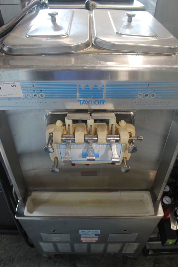 Taylor Y754-33 Commercial Stainless Steel Water Cooled Electric 2 Hopper Soft Serve Ice Cream Machine On Commercial Casters. 208-230 V, 3 Phase.