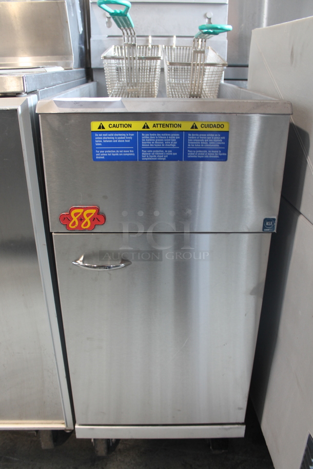 2019 Pitco Frialator 40D Stainless Steel Commercial Floor Style Natural Gas Powered Deep Fat Fryer w/ 2 Metal Fry Baskets on Commercial Casters. 107,000 BTU.  - Image 4 of 7
