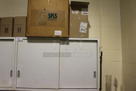 White 2 Door Cabinet w/ Contents Including Disperbyk. BUYER MUST REMOVE.