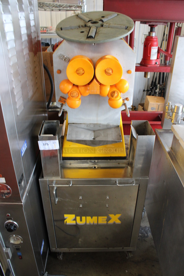 Zumex Model ZUMEX 38 Stainless Steel Commercial Floor Style Juicer on Commercial Casters. 115 Volts, 1 Phase. 24x22x62. Tested and Does Not Power On