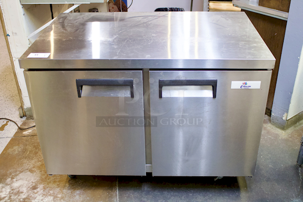 LIKE NEW! Cooler Depot UUC 48R-E-HC Solid 2-Door Under Counter Refrigerator On Commercial Casters With PVC Coated Shelf. Tested In Perfect Working Order. 
