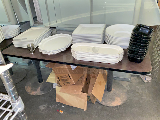 Table Full of High Quality Ceramic Platters, Includes Table Top and Bases. 

