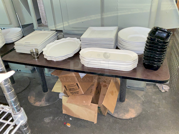 Table Full of High Quality Ceramic Platters, Includes Table Top and Bases. 

 - Image 1 of 6