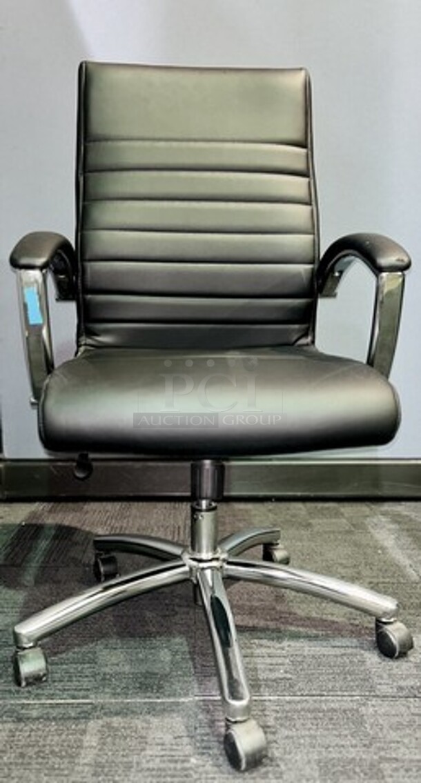 Item #60- Silver metal framed rolling office chair. Cushioned and ribbed black leather upholstery with armrests. A nice used piece! Measures 43” H x 22” W. 

 - Image 1 of 3