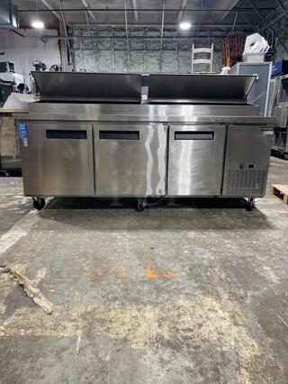 Dukers DPP90 90 3/8"W Three Door Pizza Prep Refrigerator - 24.89 Cu. Ft.