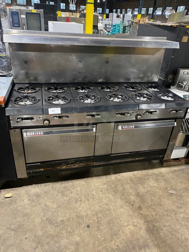 AMAZING FIND! Garland Natural Gas Powered 12 Burner Stove! With 2 Full-Sized Ovens! With Metal Oven Racks! With Raised Back Splash & Salamander Shelf! Stainless Steel! On Casters!