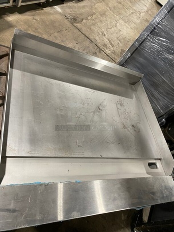 WOW! NEVER USED! Garland Commercial Natural Gas Powered 4 Burner Stove With Right Side Flat Griddle! Griddle Has Back And Side Splashes! With 2 Compartment Storage Space Underneath! All Stainless Steel! On Casters! Model: G604G36SS SN: 1712100102342 - Image 7 of 12