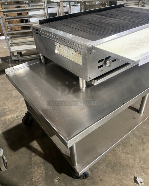 Bakers Pride Commercial Countertop Natural Gas Powered 48 Inch Char Broiler Grill! On Commercial 60 Inch Equipment Stand! With Underneath Storage Space! All Stainless Steel! On Casters! Working When Removed! Model XX8 Serial 592381707002!  - Image 2 of 10