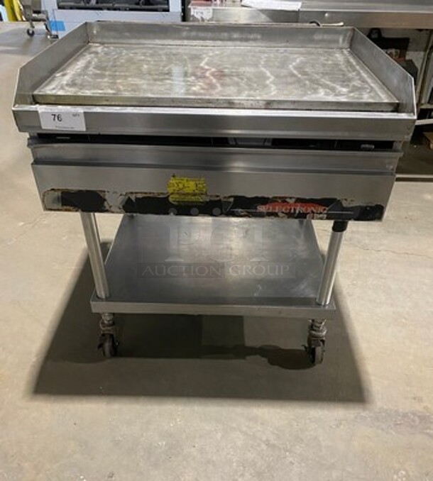 Lang Commercial Countertop Natural Gas Powered Flat Top Griddle! With Back And Side Splashes! On Equipment Stand! With Storage Space Underneath! All Stainless Steel! On Casters! SELECTRONIC SERIES! Model: G3EI SN: E76955 - Image 1 of 11