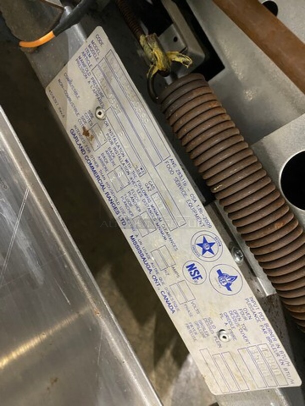 Garland Commercial Natural Gas Powered 4 Burner Stove! With Back Splash! With Oven Underneath! Metal Oven Rack! All Stainless Steel! On Casters! Model: 144R SN: 1601100100589 - Image 9 of 10