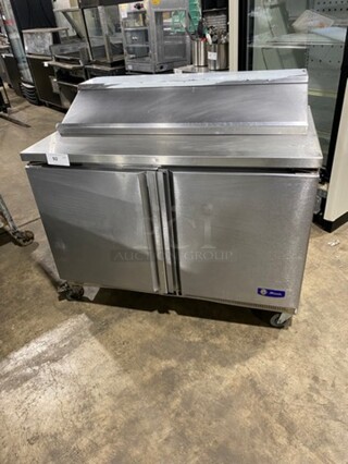 Migali Commercial Refrigerated Mega Top Sandwich Prep Table! With 2 Door Storage Space Underneath! Poly Coated Racks! All Stainless Steel! On Casters! Model: G3SP4812 SN: 10120088M 115V 60HZ 1 Phase