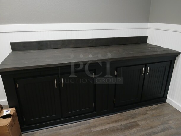 Black Built in Place Cabinet W/4 Doors. 
96"x33"x36"

**LABOR FOR REMOVAL ADDITIONAL FEE, CONTACT MISSOURI DIVISION FOR LABOR QUOTE OR ADDITIONAL QUESTIONS. - Image 1 of 5