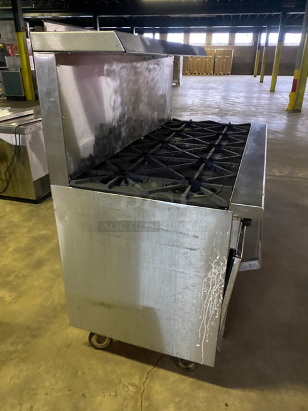 Garland Commercial Natural Gas Powered 10 Burner Stove! With 2 Full-Size Ovens Underneath! With Metal Oven Racks! With Raised Back Splash & Salamander Shelf! Stainless Steel! On Casters! - Image 2 of 10