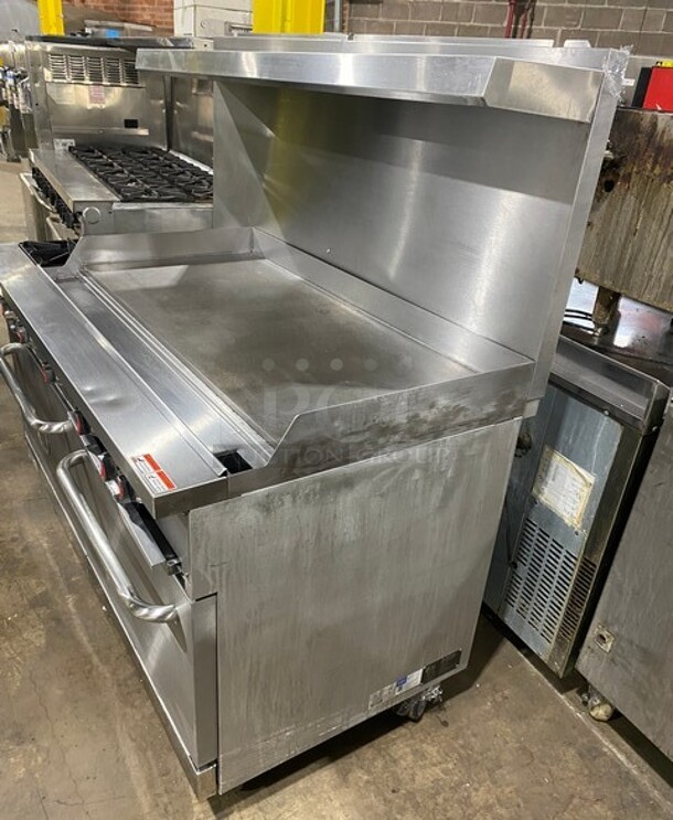 CPG Commercial LP Powered Flat Top Griddle Stove With Left Side 2 Burner! Griddle Has Side Splashes! With Raised Back Splash And Salamander Shelf! With 2 Oven Underneath! Metal Oven Racks! All Stainless Steel! On Casters! Working When Removed! Model: S60G48L SN: 09227429 - Image 2 of 12
