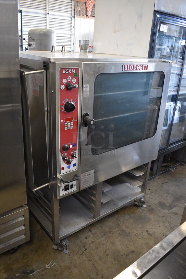 Blodgett Model BCX14GZ/AA Natural Gas Powered Stainless Steel Commercial Convection Oven w/ View Through Door and Pan Rack on Commercial Casters. 50,000 BTU. 40x36x55