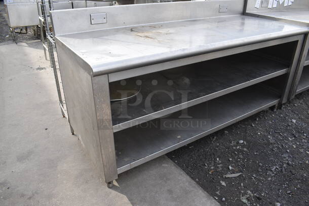 Stainless Steel Table w/ Back Splash and 2 Under Shelves. 72x30x38.5