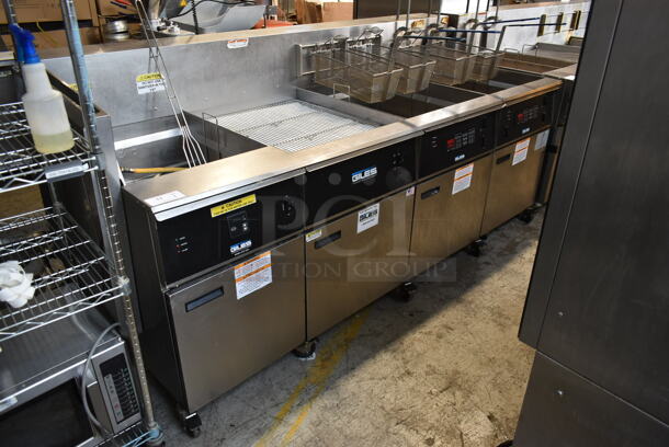 Giles EOF-24 Stainless Steel Commercial Electric Powered 3 Bay Fryer w/ Giles EOF-BIB Dumping Station and 4 Metal Fry Baskets. 480 Volts, 3 Phase.