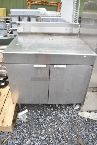 Stainless Steel Counter w/ 2 Doors and Back Splash. 