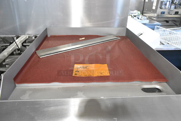 BRAND NEW! 2023 Garland G60-6G24CR Stainless Steel Commercial Floor Style Natural Gas Powered 6 Burner Range w/ Right Side Flat Top Griddle, 2 Ovens, Over Shelf and Back Splash. - Image 7 of 12