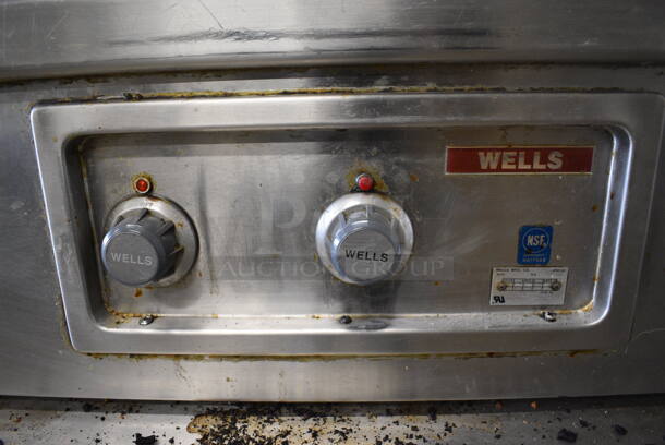 Wells Stainless Steel Commercial Work Station w/ Flat Top Griddle, Charbroiler, Well and Side Under Shelves. Does Not Come w/ Delfield 4 Drawer Chef Base: Goes GREAT w/ Item 246! 115 Volts, 1 Phase Refrigeration. 208-240 Volt, 3 Phase Heating. 114x36x34 - Image 2 of 10