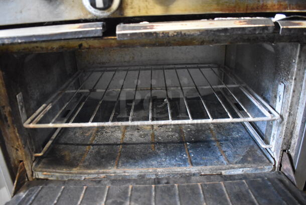 Garland SunFire Stainless Steel Commercial Natural Gas Powered 10 Burner Range w/ 2 Ovens, Over Shelf and Back Splash on Commercial Casters.  - Image 7 of 8